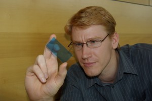 Craig Priest with a microfluidic chip. Credit: Niall Byrne, Fresh Science