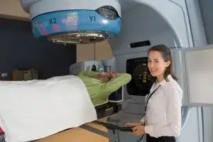 Sarah Everitt treating a patient with radiation therapy at the Peter MacCallum Cancer Centre. 